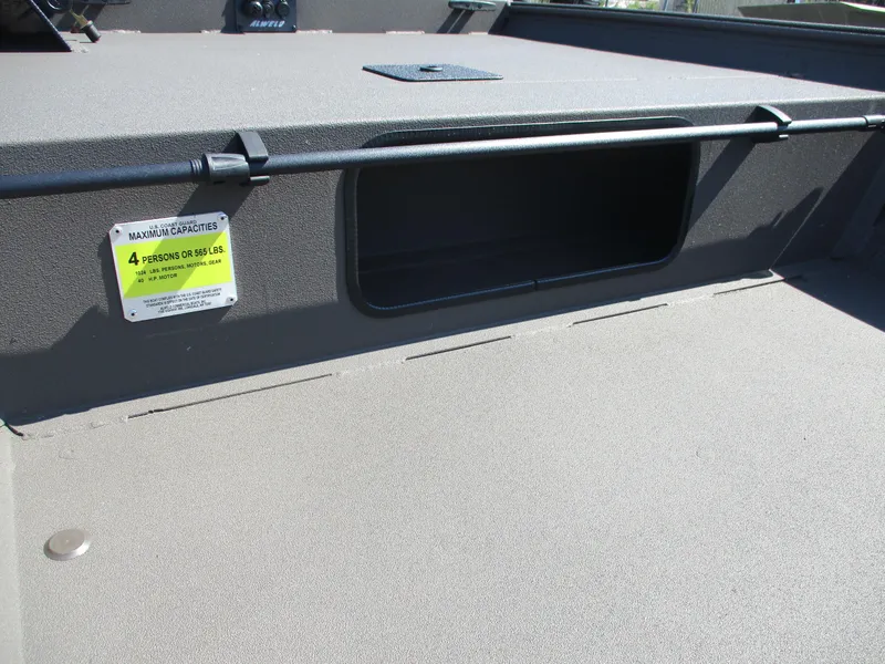 Slide: The Image of 2025 Alweld 1548 Marsh boat interior with storage compartment and capacity label. - 9