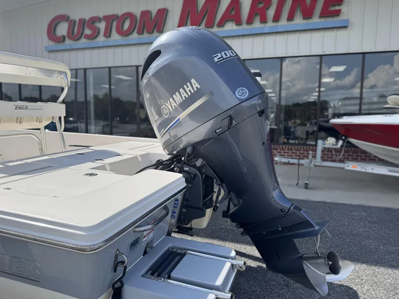 Slide: The Image of 2014 Pathfinder 2200 TRS boat with Yamaha 200 engine at Custom Marine dealership. - 4