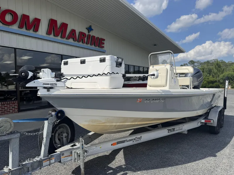 Slide: The Image of 2014 Pathfinder 2200 TRS boat on trailer outside marine dealership. - 5