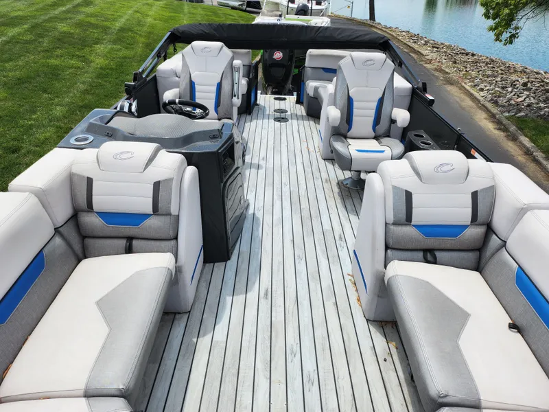 Slide: The Image of 2017 Crest Caliber 230 SLC pontoon boat with spacious seating and modern design. - 11