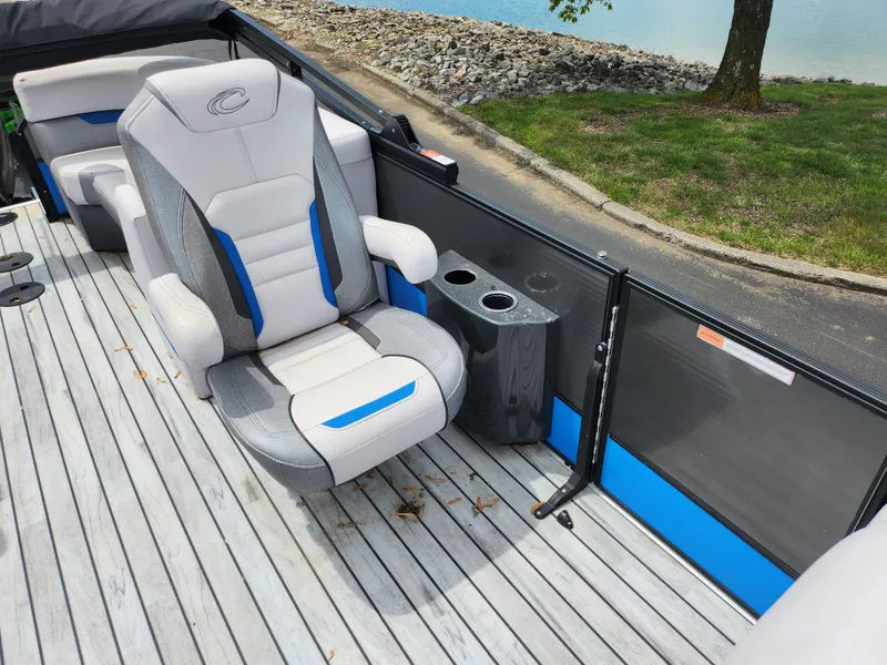 Slide: The Image of 2017 Crest Caliber 230 SLC boat interior with plush seating and cup holders. - 12