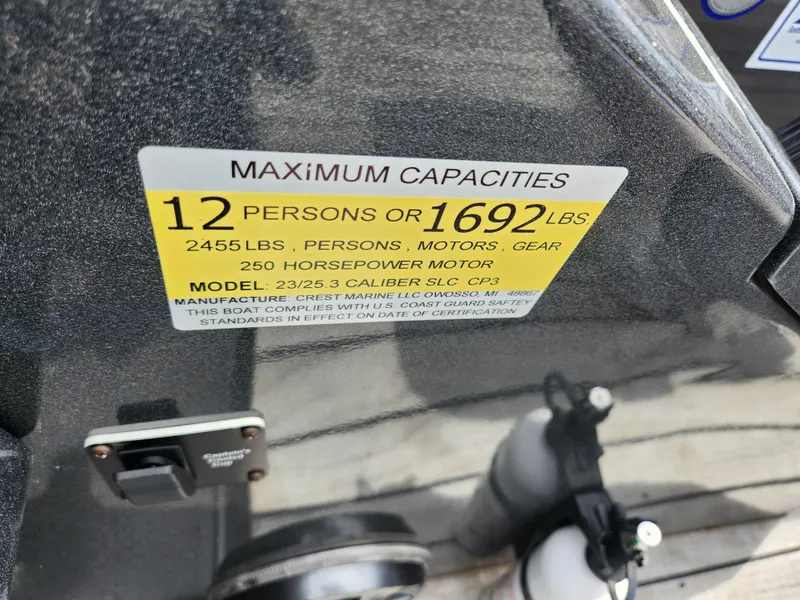 Slide: The Image of 2017 Crest Caliber 230 SLC capacity label, 12 persons or 1692 lbs, 250 horsepower motor. - 14