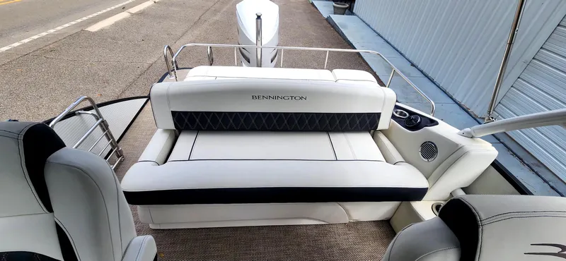 Slide: The Image of 2020 Bennington R 25 RSBA boat interior with white seating and sleek design. - 11