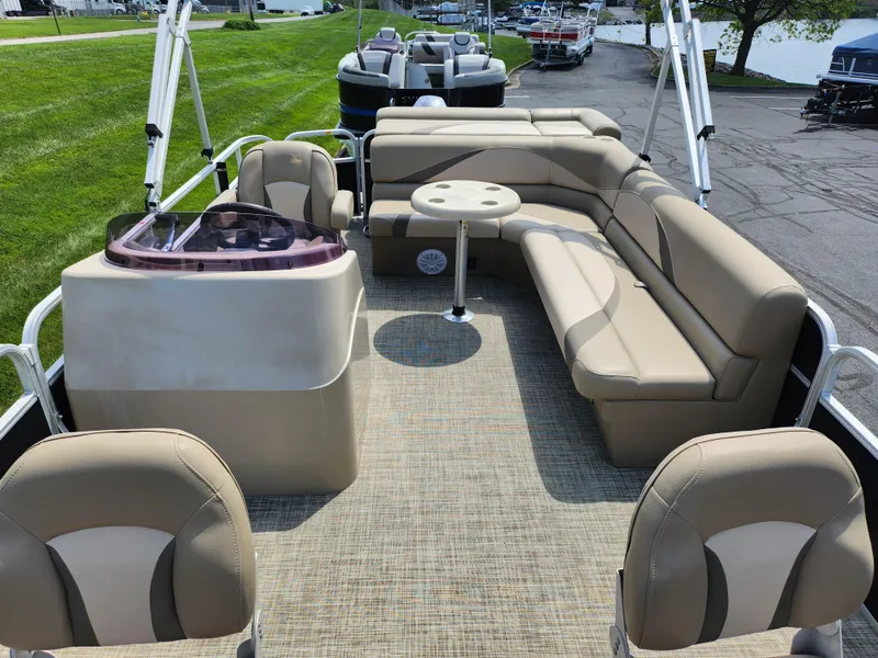 Slide: The Image of 2016 SunCatcher V20 Fish & Cruise pontoon boat with beige seating and helm. - 11