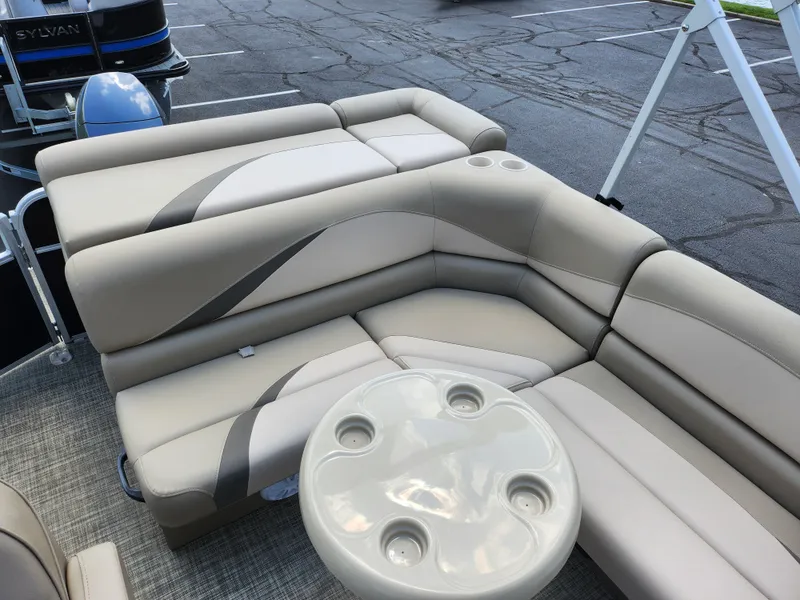 Slide: The Image of 2016 SunCatcher V20 Fish & Cruise boat interior with beige seating and cup holders. - 14