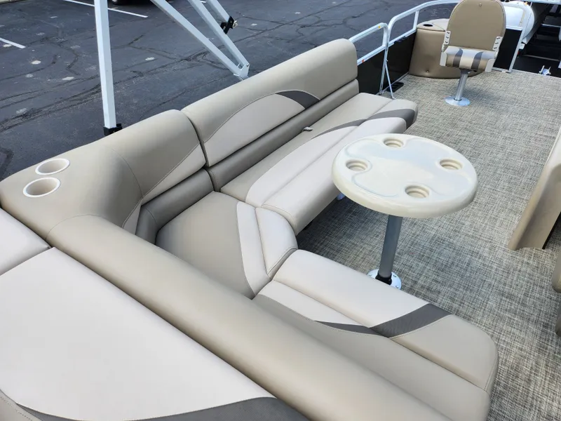 Slide: The Image of 2016 SunCatcher V20 Fish & Cruise boat interior with beige seating and table. - 17