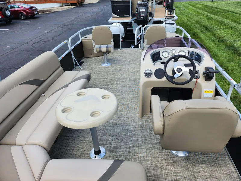Slide: The Image of 2016 SunCatcher V20 Fish & Cruise pontoon boat interior with seating and steering console. - 18