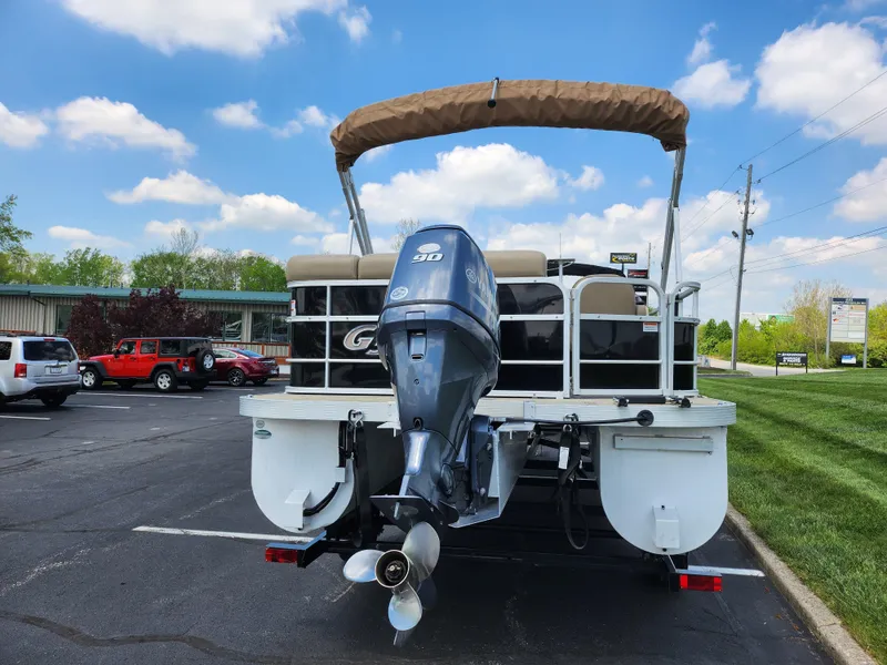 Slide: The Image of 2016 SunCatcher V20 Fish & Cruise boat with outboard motor, parked outdoors. - 2