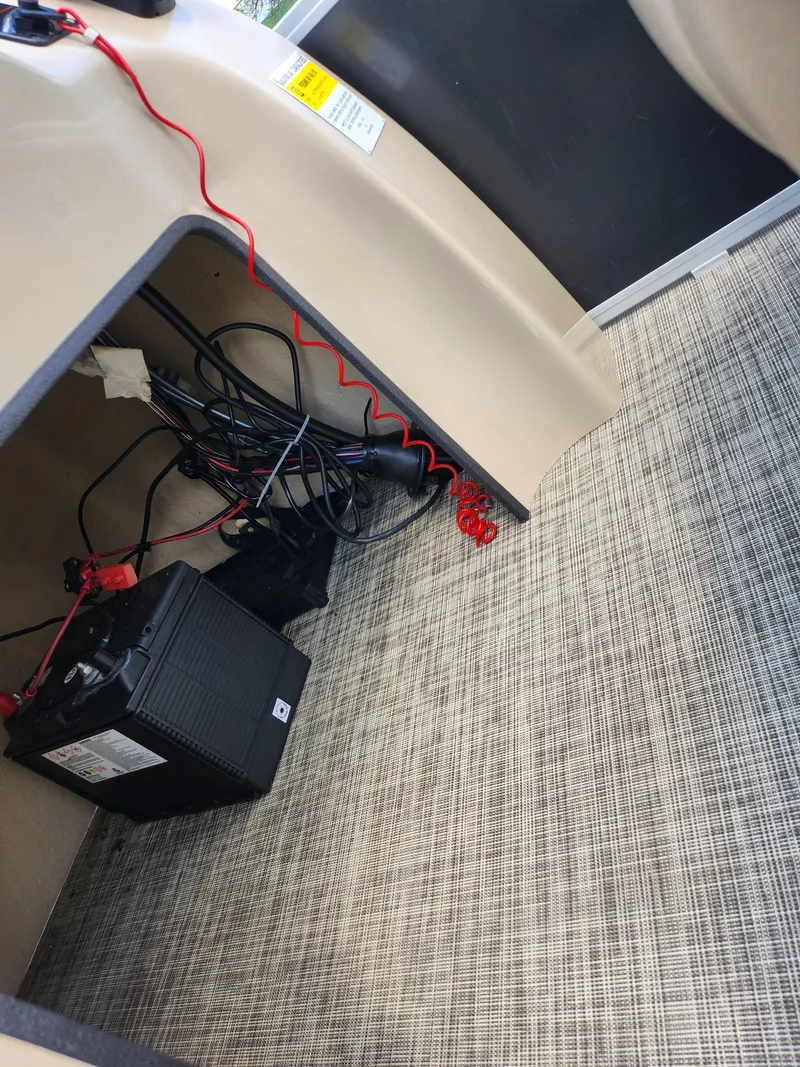 Slide: The Image of 2016 SunCatcher V20 Fish & Cruise boat interior with battery and wiring setup. - 20