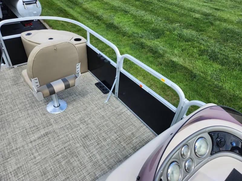 Slide: The Image of 2016 SunCatcher V20 Fish & Cruise pontoon boat interior with seating and control panel. - 21