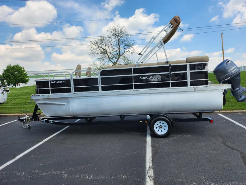 Slide: The Image of 2016 SunCatcher V20 Fish & Cruise pontoon boat on trailer in parking lot. - 4