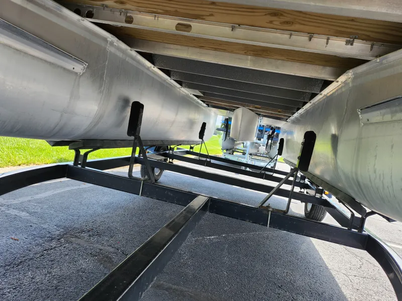 Slide: The Image of Underneath view of a 2016 SunCatcher V20 Fish & Cruise pontoon boat on a trailer. - 7