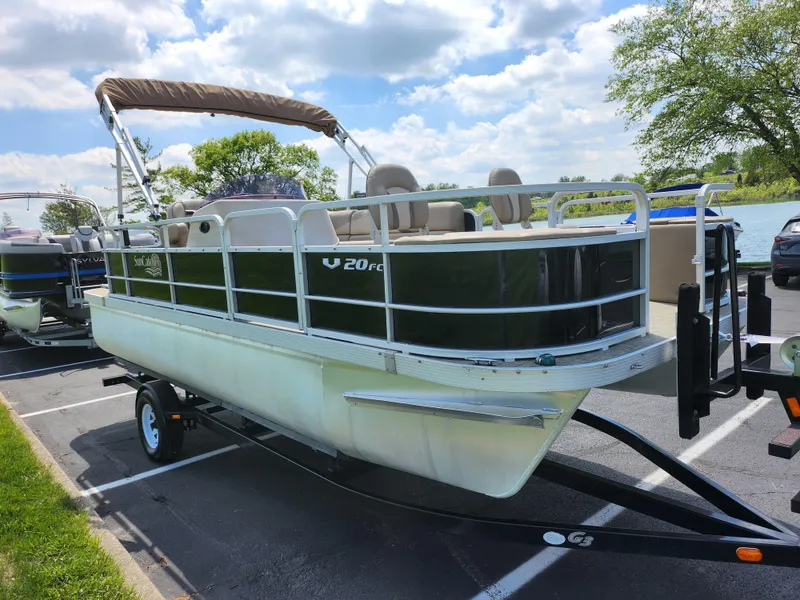 Slide: The Image of 2016 SunCatcher V20 Fish & Cruise pontoon boat on trailer in parking lot. - 8