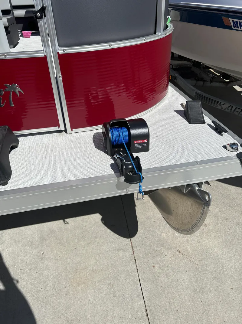 Slide: The Image of Red Custom Maui 210 Cruise boat, 2025 model, with winch and blue rope on deck. - 2