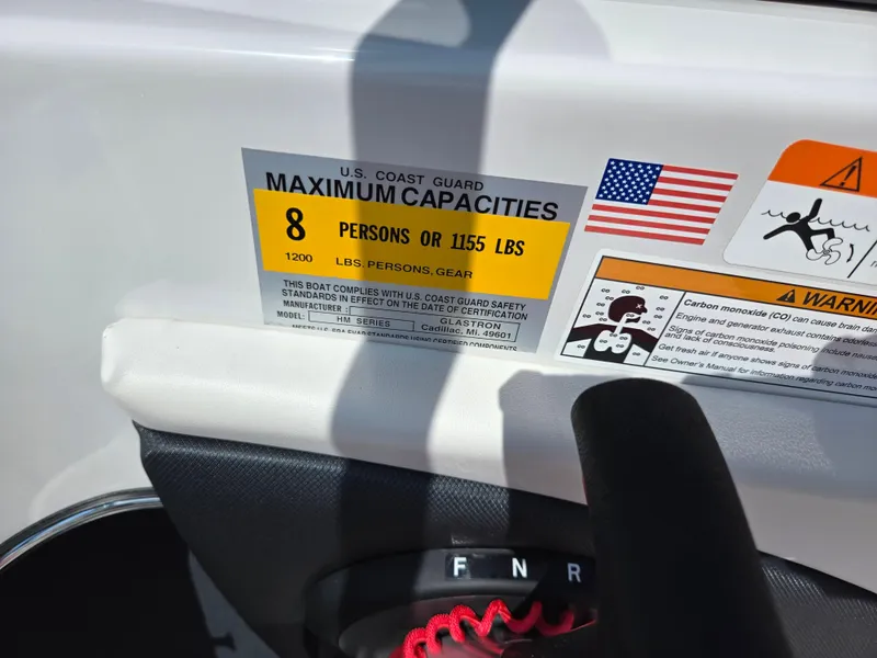 Slide: The Image of 2014 Glastron GT 185 capacity label, maximum 8 persons or 1155 lbs, safety warnings. - 14