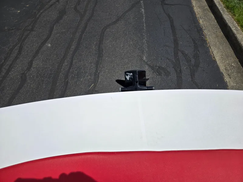 Slide: The Image of Rear view of a 2014 Glastron GT 185 boat on a paved road. - 24