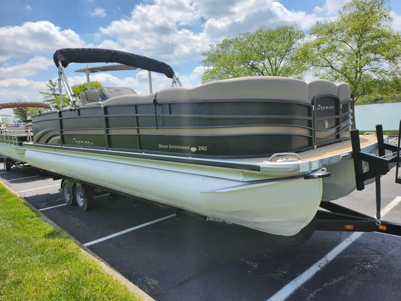 Slide: The Image of 2013 Premier 290 Grand Entertainer pontoon boat on trailer in parking lot. - 10
