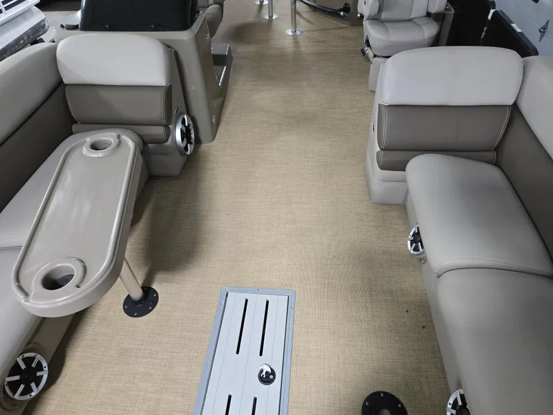 Slide: The Image of 2013 Premier 290 Grand Entertainer interior with beige seating and table. - 12