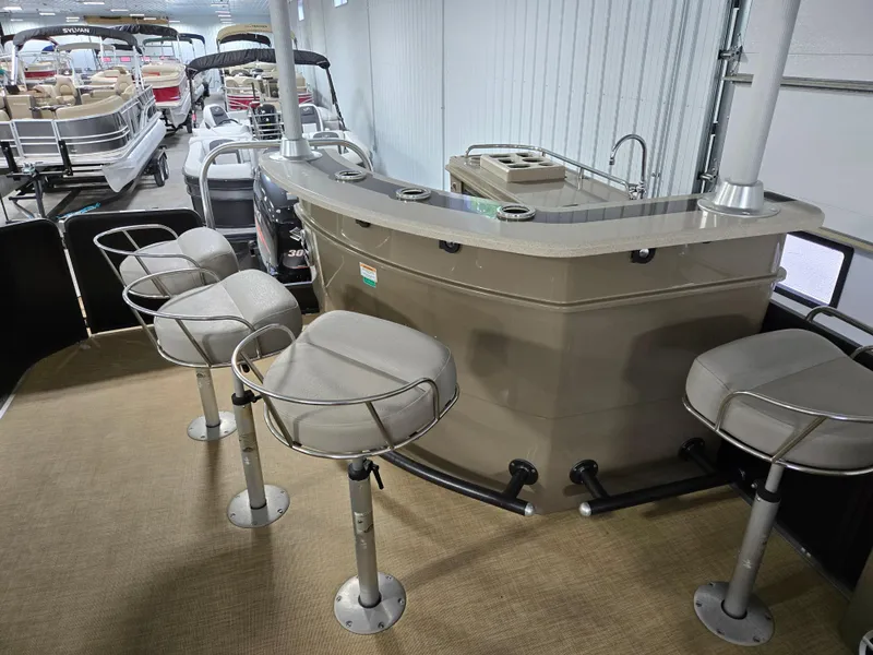 Slide: The Image of 2013 Premier 290 Grand Entertainer pontoon boat with bar seating and modern amenities. - 16