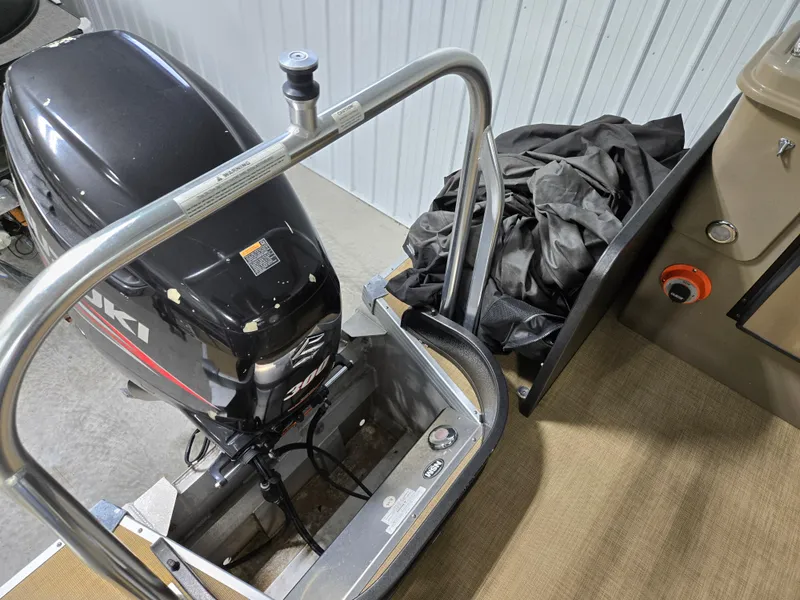 Slide: The Image of 2013 Premier 290 Grand Entertainer boat with Suzuki outboard motor and protective cover. - 20