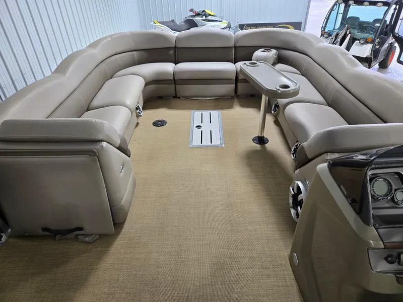 Slide: The Image of 2013 Premier 290 Grand Entertainer pontoon boat with spacious seating and modern interior design. - 28