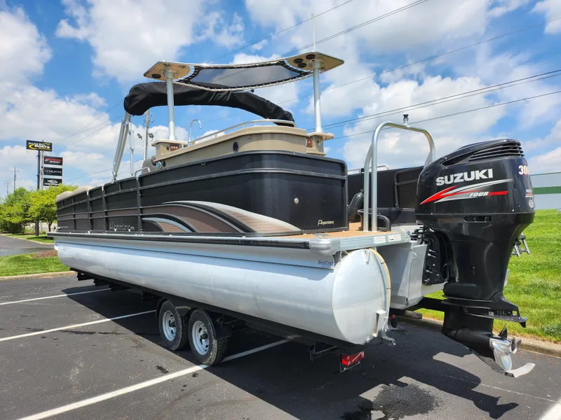 Slide: The Image of 2013 Premier 290 Grand Entertainer pontoon boat with Suzuki outboard motor on trailer. - 3