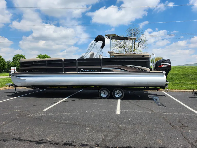 Slide: The Image of 2013 Premier 290 Grand Entertainer pontoon boat on trailer, parked outdoors. - 5