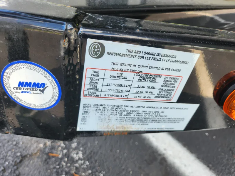 Slide: The Image of Sticker on a 2013 Premier 290 Grand Entertainer showing tire and loading information. - 9