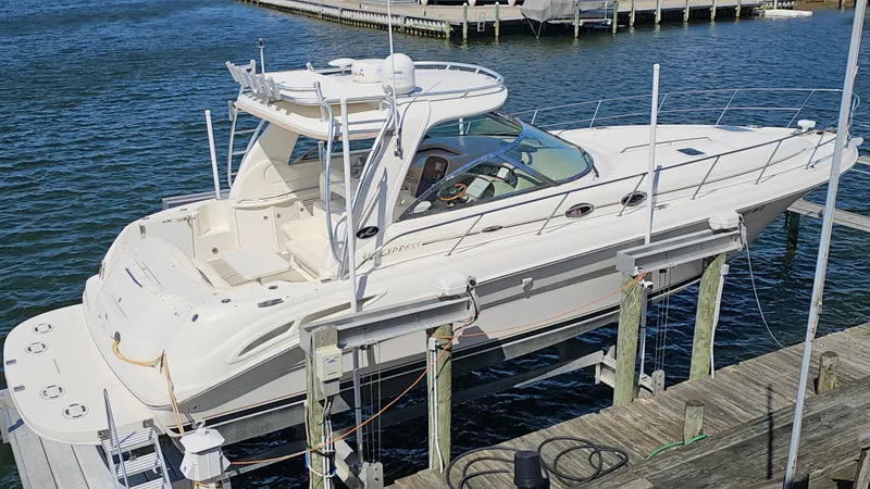 Slide: The Image of 2003 Sea Ray 410 Express Cruiser docked at marina, side view. - 1