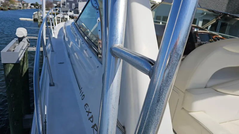 Slide: The Image of 2003 Sea Ray 410 Express Cruiser docked, showcasing sleek design and comfortable seating. - 15