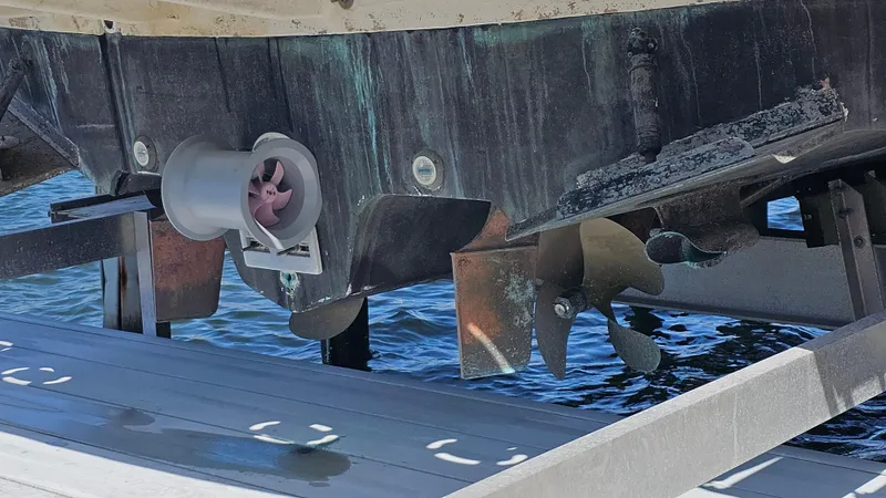 Slide: The Image of 2003 Sea Ray 410 Express Cruiser propeller and stern view at dock. - 9