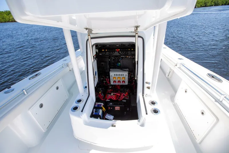 Slide: The Image of 2022 Yellowfin 26 Hybrid boat with open console, showing internal wiring and components. - 15