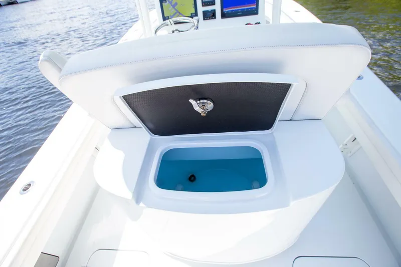 Slide: The Image of 2022 Yellowfin 26 Hybrid boat with open storage compartment on deck. - 18