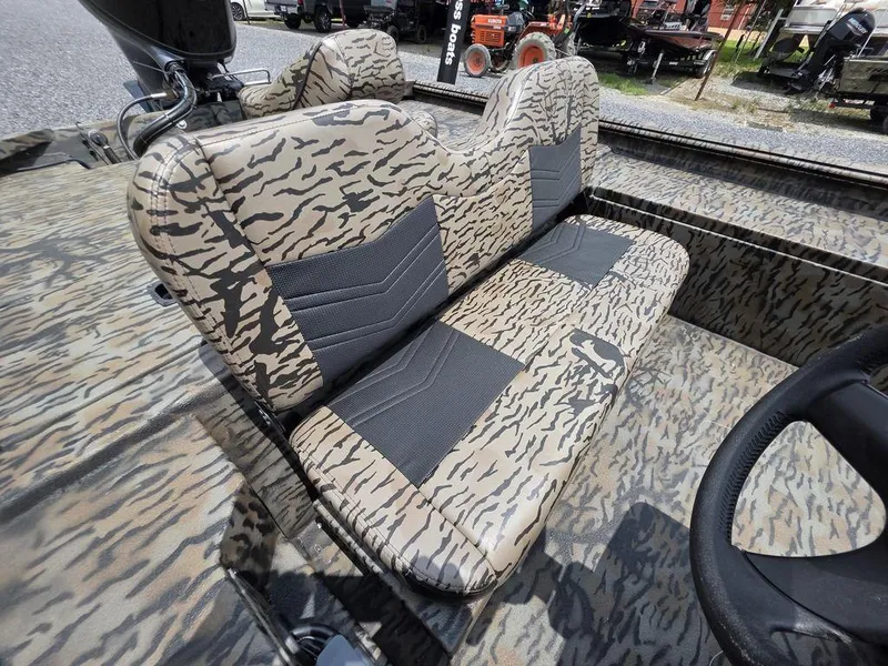 Slide: The Image of Camouflage-patterned seats in a 2025 Xpress XP180 boat, showcasing modern design and comfort. - 12