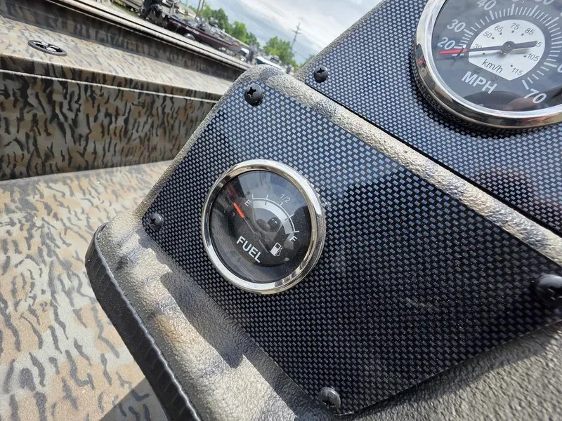 Slide: The Image of Fuel gauge on 2025 Xpress XP180 boat dashboard with camouflage pattern. - 15