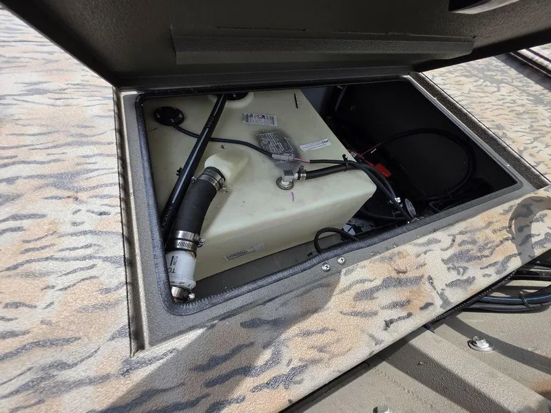 Slide: The Image of Open compartment of 2025 Xpress XP180 boat showing internal components and wiring. - 4