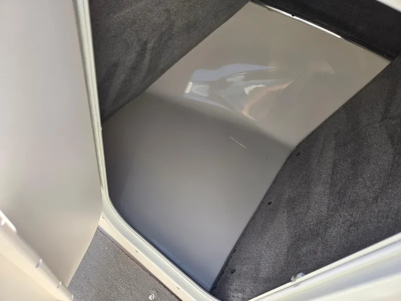 Slide: The Image of Interior storage compartment of a 2013 Bryant 210 STE boat. - 15