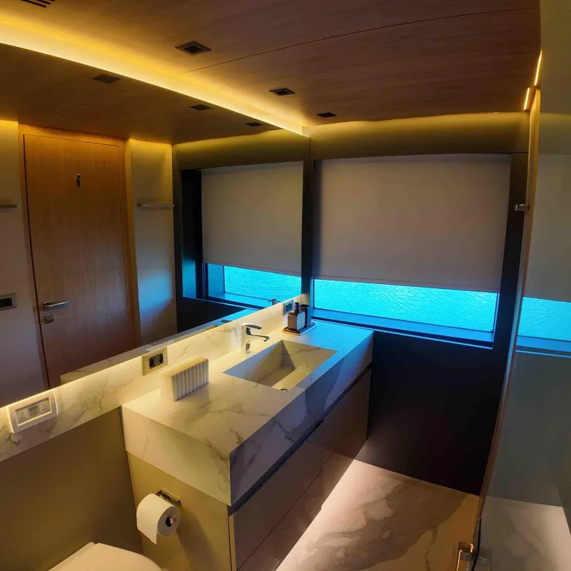 Slide: The Image of Luxurious bathroom interior on Inace AVENTURA 106 yacht, featuring modern design and ambient lighting. - 14