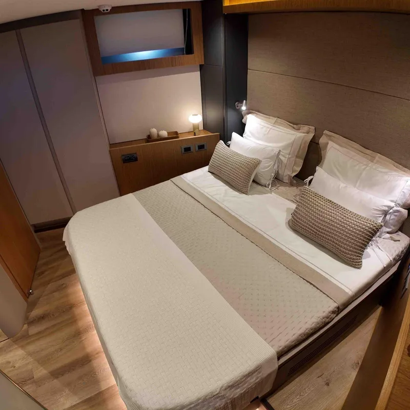 Slide: The Image of Luxurious bedroom interior of 2027 Inace AVENTURA 106 yacht, featuring elegant bedding and modern design. - 15