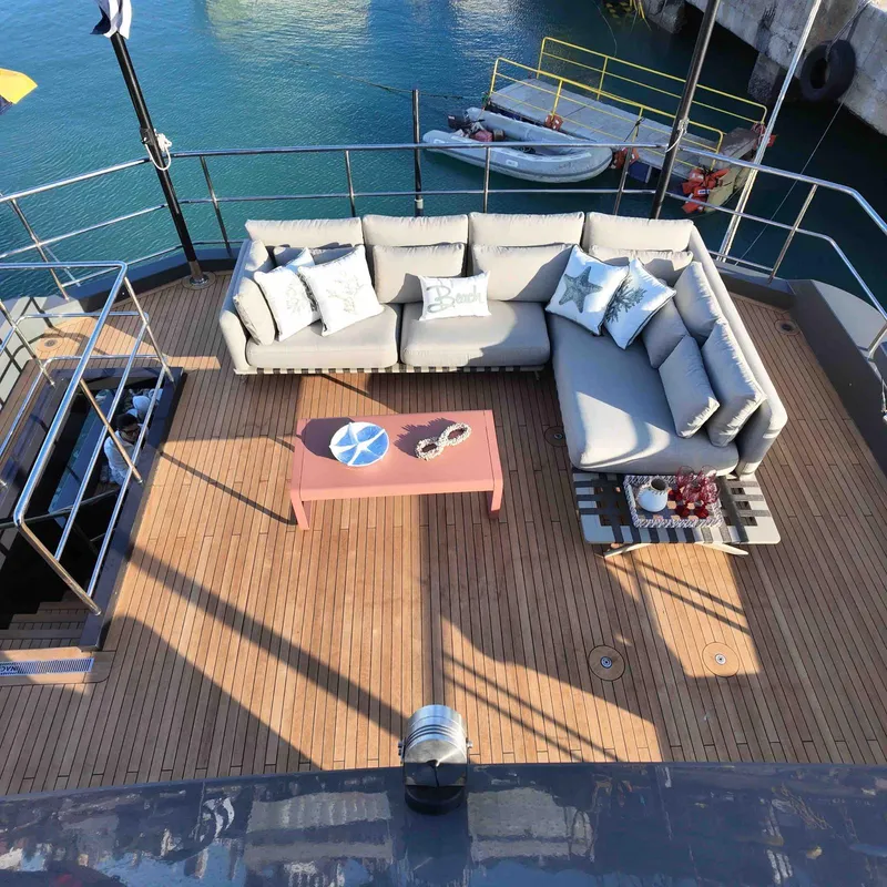 Slide: The Image of Luxurious deck of 2027 Inace AVENTURA 106 yacht with cozy seating and ocean view. - 4