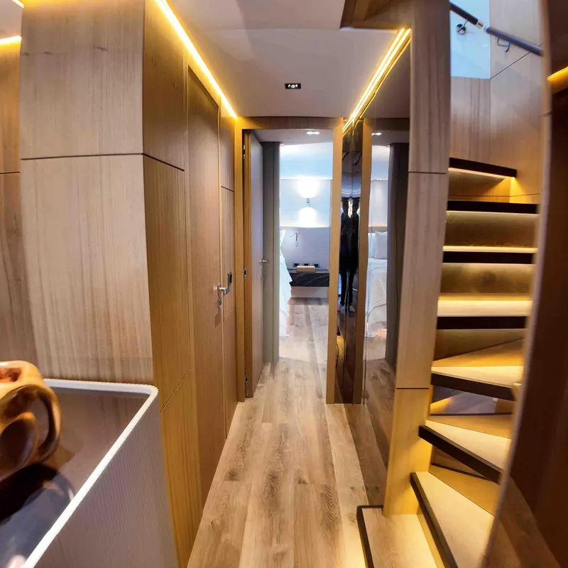 Slide: The Image of Luxurious interior of 2027 Inace AVENTURA 106 yacht with modern wooden design and staircase. - 6