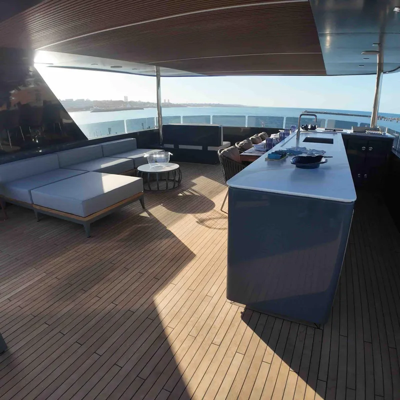 Slide: The Image of Luxurious deck of 2027 Inace AVENTURA 106 yacht with modern seating and ocean view. - 7