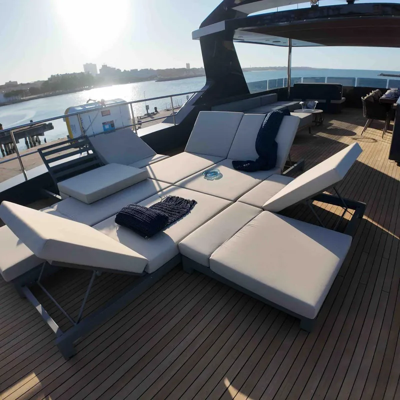 Slide: The Image of Luxurious deck seating on 2027 Inace AVENTURA 106 yacht, overlooking serene waterfront. - 3