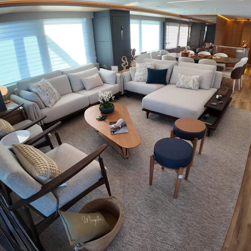 Slide: The Image of Luxurious interior of Inace AVENTURA 106 yacht, featuring elegant seating and modern decor, 2027 model. - 8