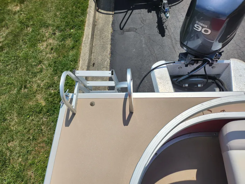 Slide: The Image of 2012 Bennington 22 SSL pontoon boat with Yamaha 90 engine and boarding ladder. - 18