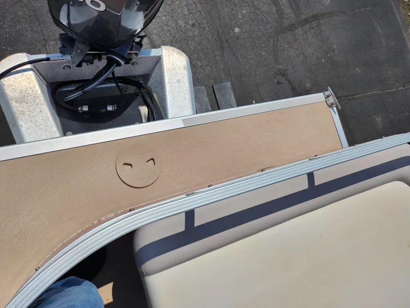 Slide: The Image of 2012 Bennington 22 SSL boat interior with beige seating and control panel. - 19