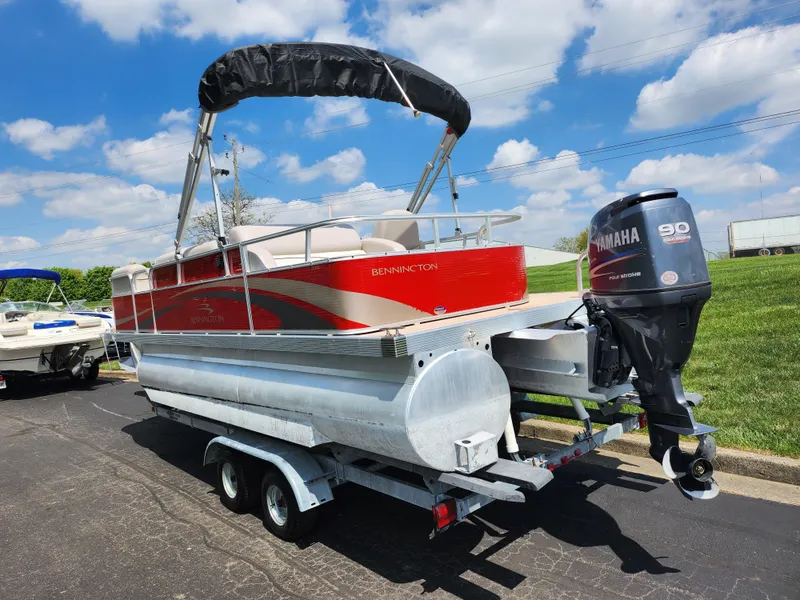 Slide: The Image of 2012 Bennington 22 SSL pontoon boat on trailer with Yamaha outboard motor. - 3
