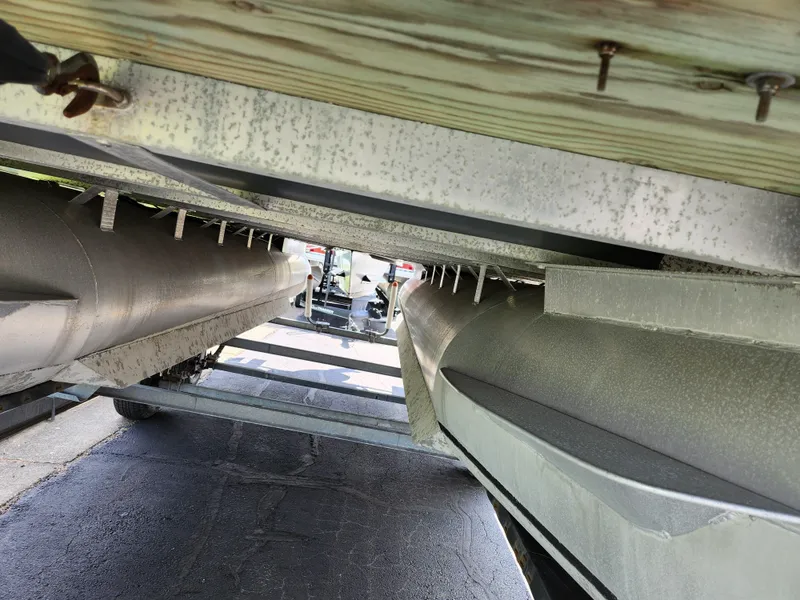Slide: The Image of Underneath view of a 2012 Bennington 22 SSL pontoon boat on a trailer. - 8