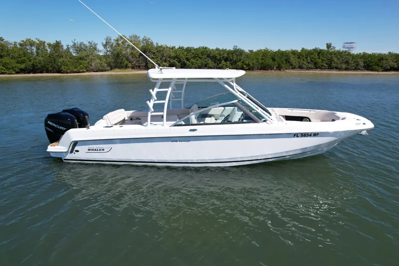 Slide: The Image of 2017 Boston Whaler 270 Vantage boat on calm water, side view. - 10