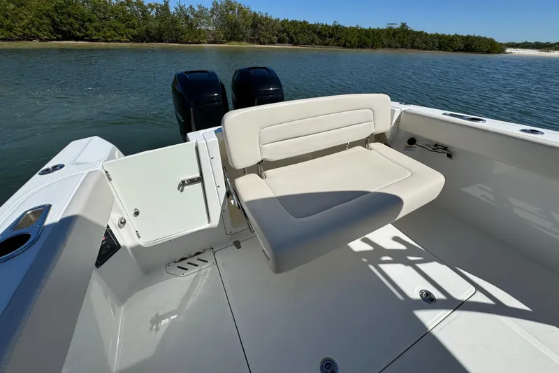 Slide: The Image of 2017 Boston Whaler 270 Vantage boat with seating, open water view. - 24